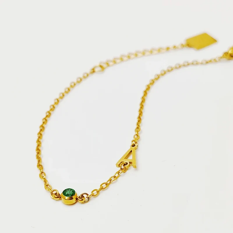 Pulsera iniciales circonitas – Acero 316L oro/plateado | White & You